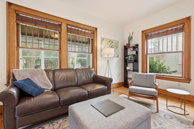 Living room with original woodwork and fireplace
